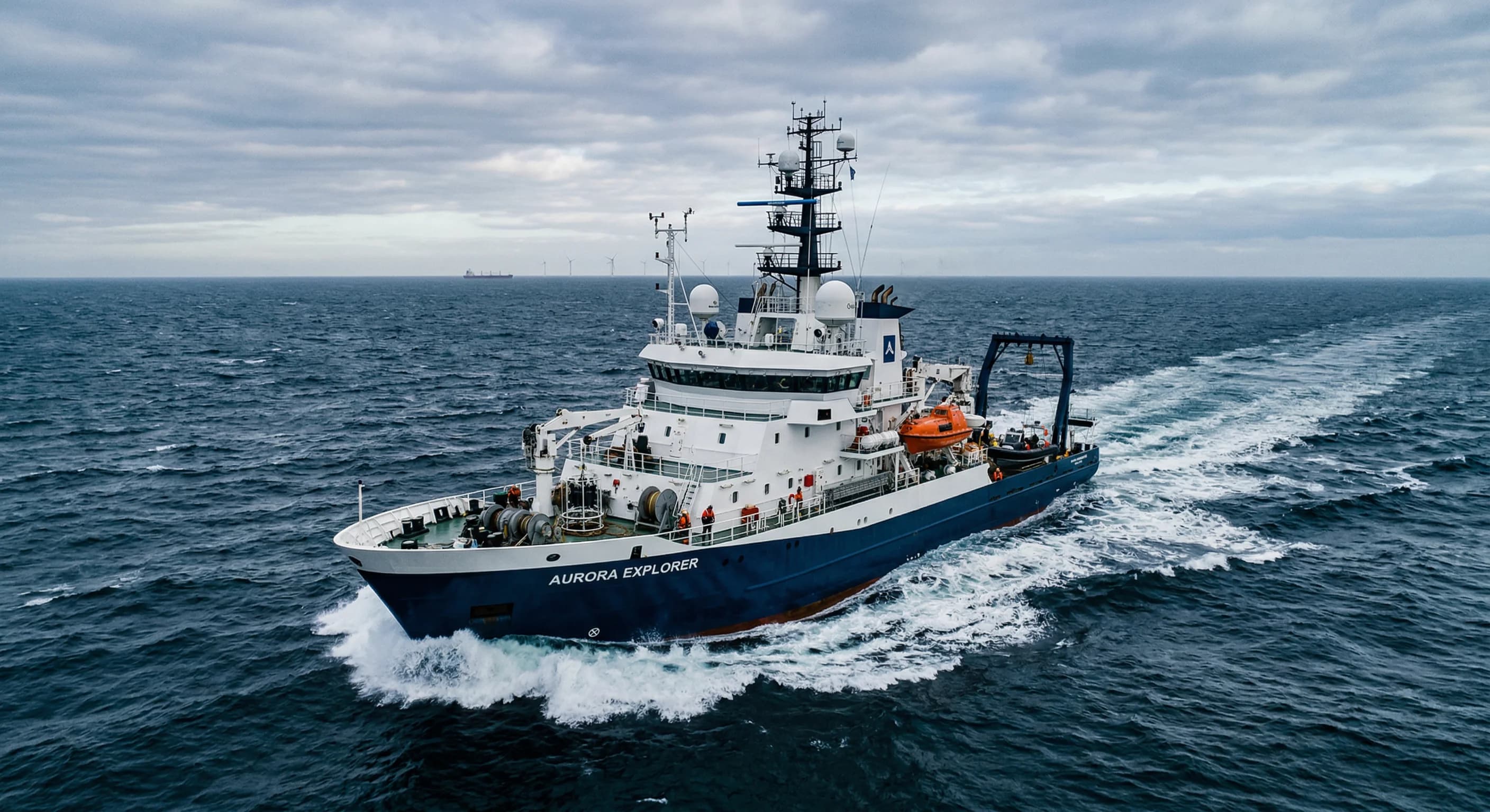 A high-tech research vessel equipped with advanced sensor arrays, cutting through the deep blue waters of the North Sea under a soft, overcast sky. The composition is a wide-angle shot from a low dron