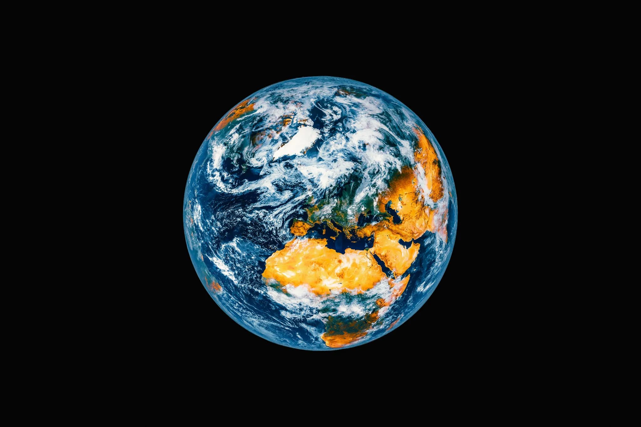 Planet earth seen from space with clouds and landmasses.