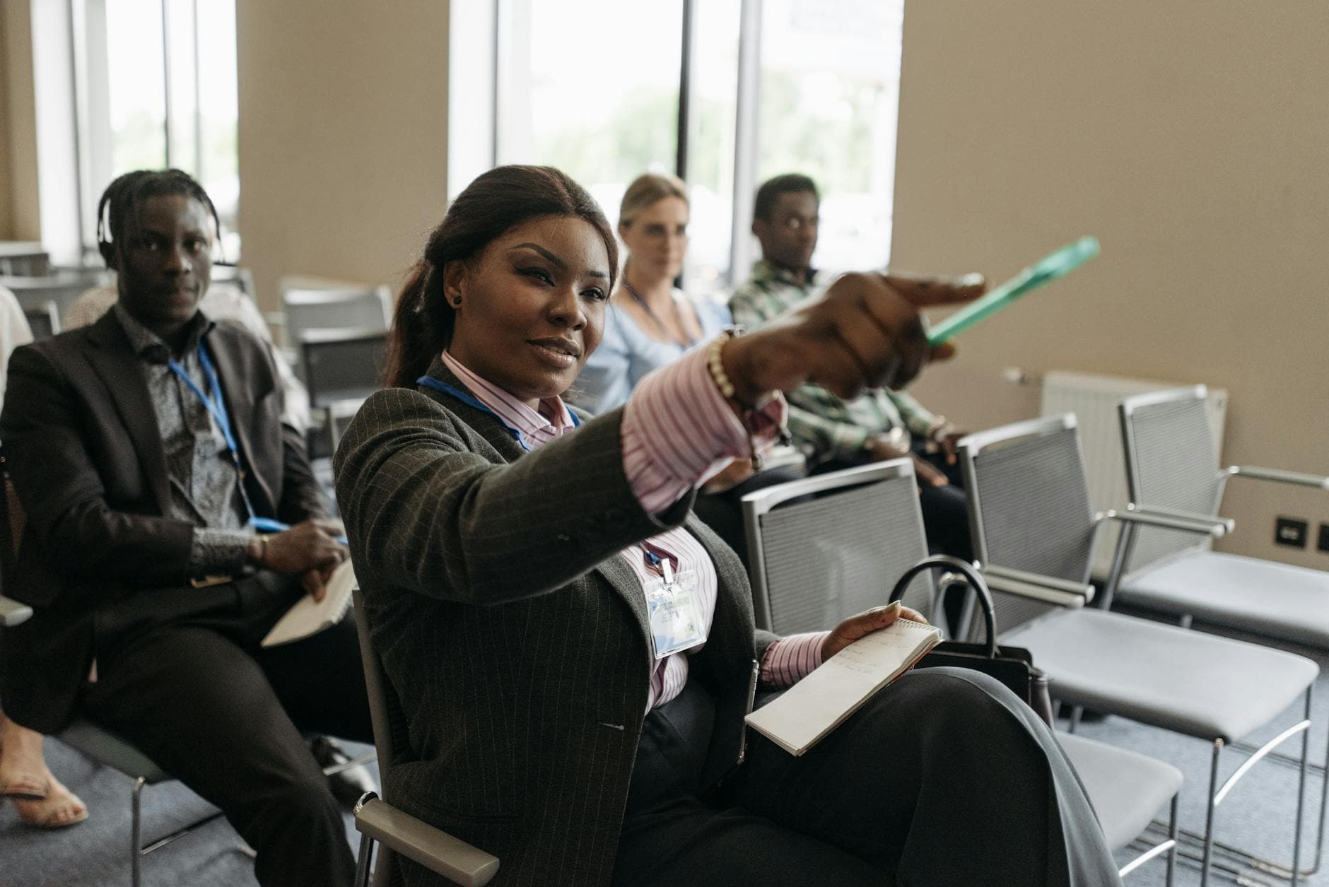 Diverse group of professionals listening attentively at a business conference.