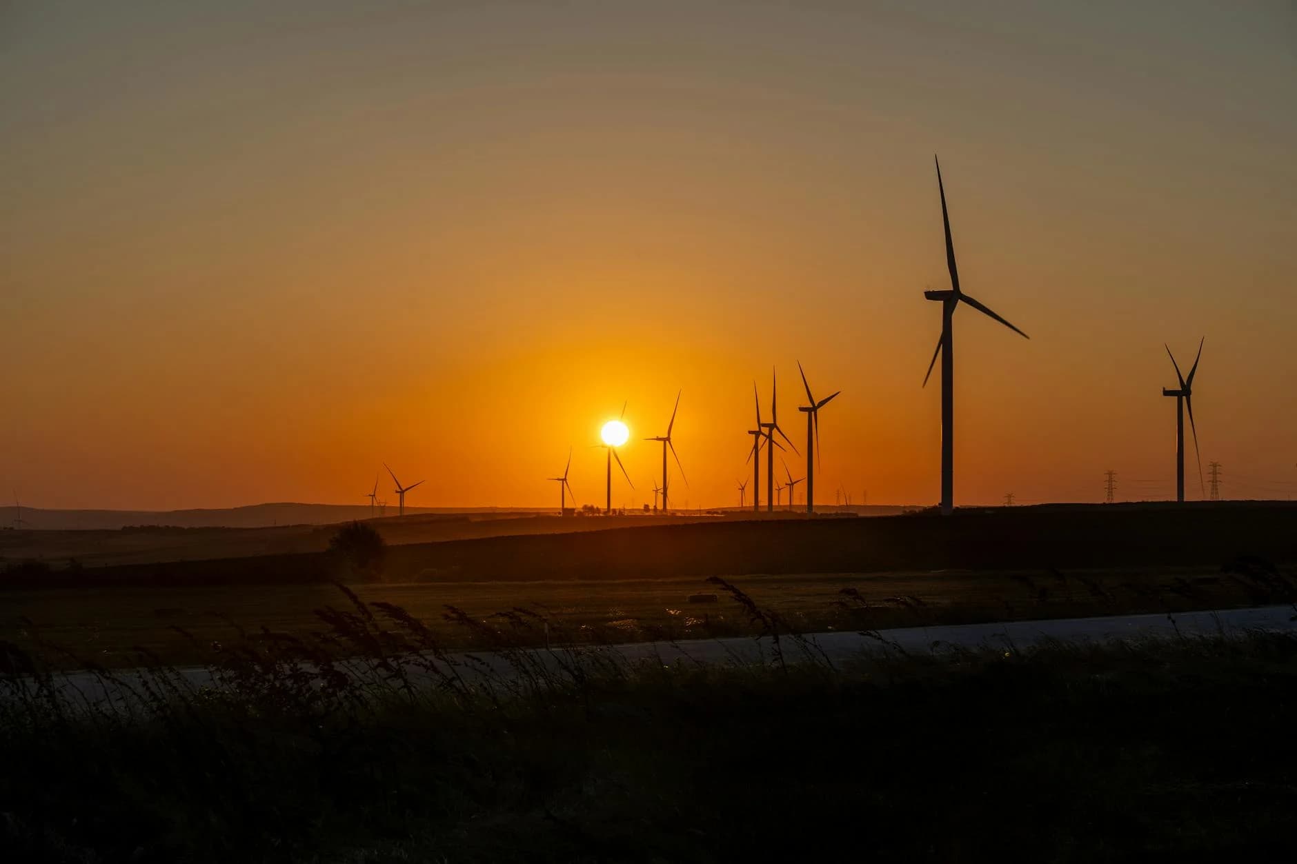 Beautiful sunset over a wind farm in Silivri, İstanbul, showcasing sustainable energy efforts.