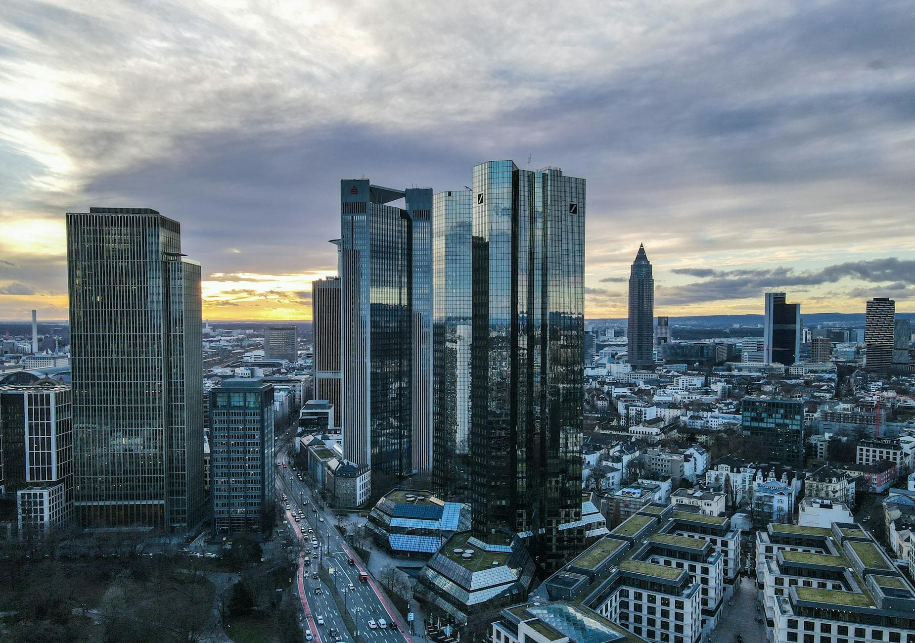 Aerial view of Frankfurt's financial district skyscrapers during a stunning sunset.